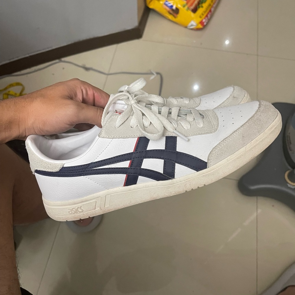 ASICS sneakers.
